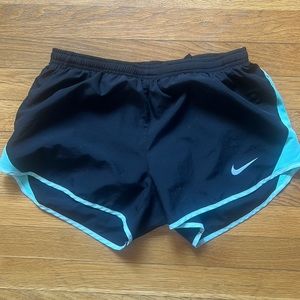 Teal and black Nike shorts